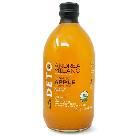 Bottle of Andrea Milano Organic Apple Cider Vinegar on a white background
