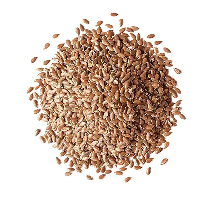 Pile of flaxseeds on a white background