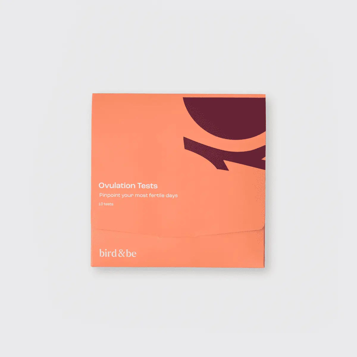 Orange packaging of ovulation tests with 'bird & be' branding on a light gray background
