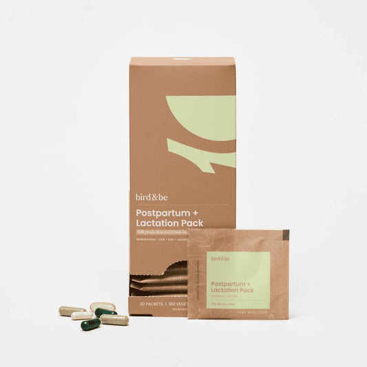Postpartum and lactation pack by bird & be with packaging and capsules on a white background