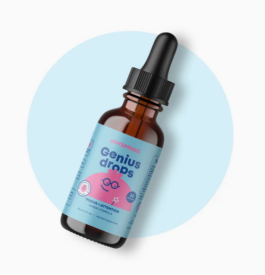 Bottle of JoySpring Genius drops on a light blue background