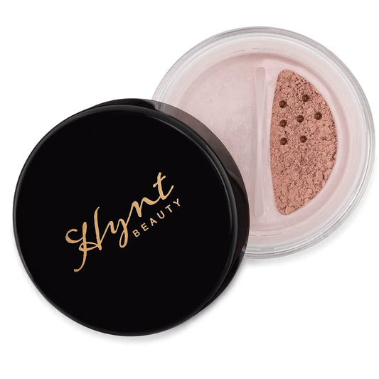 Hynt Beauty loose powder with black lid on a white background