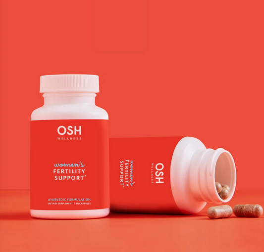OSH Wellness women's fertility support supplement bottle on a red background