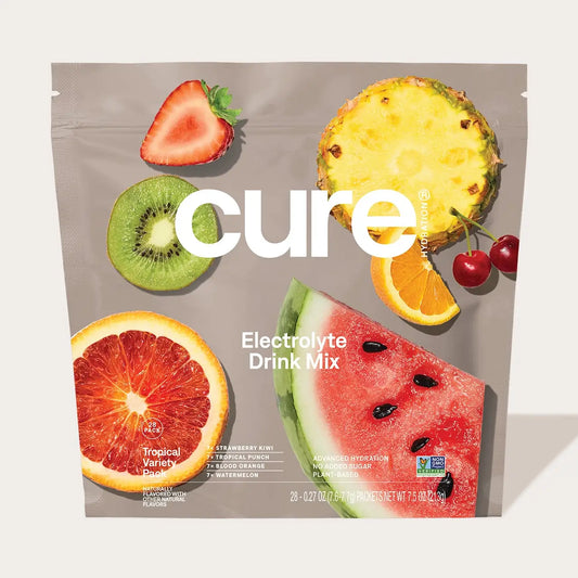 Cure Electrolyte Drink Mix package with tropical fruits on a white background
